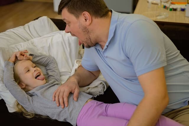 dad-in-the-game-mode-looks-at-the-throat-of-a-sick-